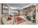 Spacious living room with comfortable seating, tile floors, and a view of the staircase and entrance at 8914 Termoli St, Las Vegas, NV 89123