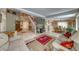 Open-concept living room with tile flooring and comfortable furnishings, perfect for Gathering gatherings at 8914 Termoli St, Las Vegas, NV 89123