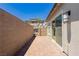 Private back patio featuring brick pavers and block wall at 901 Allister Fields Ln, Las Vegas, NV 89138