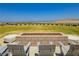 An outdoor patio features an outdoor fire pit, chairs, and sweeping vistas of the city and mountains at 901 Allister Fields Ln, Las Vegas, NV 89138