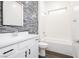 Bright bathroom featuring a modern vanity, stylish tile backsplash, and bathtub at 901 Allister Fields Ln, Las Vegas, NV 89138