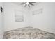 Bright bedroom featuring natural light from two windows and stylish flooring at 901 Allister Fields Ln, Las Vegas, NV 89138