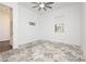 Bright bedroom featuring a modern ceiling fan, neutral color palette, and stylish flooring at 901 Allister Fields Ln, Las Vegas, NV 89138
