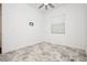 Bright bedroom featuring a ceiling fan, neutral paint, and a patterned floor at 901 Allister Fields Ln, Las Vegas, NV 89138