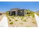 Charming single-story home with modern stone accents and desert landscaping at 901 Allister Fields Ln, Las Vegas, NV 89138