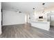 Bright living room with modern kitchen island, stainless steel appliances, and open floor plan at 901 Allister Fields Ln, Las Vegas, NV 89138