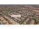 This aerial view showcases a dense residential area with many homes and streets at 9017 Iron Hitch Ave, Las Vegas, NV 89143