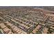 This aerial view shows numerous uniform houses in a well-organized neighborhood at 9017 Iron Hitch Ave, Las Vegas, NV 89143