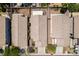 Aerial view of the property showcasing the roof and backyard features of neighboring homes at 9017 Iron Hitch Ave, Las Vegas, NV 89143