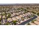 Community aerial featuring multiple homes with desert landscaping and efficient street design at 9017 Iron Hitch Ave, Las Vegas, NV 89143