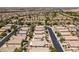 Overhead neighborhood view showcasing the property, street layout, and surrounding houses at 9017 Iron Hitch Ave, Las Vegas, NV 89143