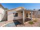 The backyard boasts a covered patio and low-maintenance landscaping at 9017 Iron Hitch Ave, Las Vegas, NV 89143