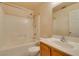 Bathroom features a tub-shower combination and a wood vanity at 9017 Iron Hitch Ave, Las Vegas, NV 89143