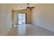 Light-filled dining room featuring tile flooring and glass slider doors with access to the backyard at 9017 Iron Hitch Ave, Las Vegas, NV 89143