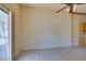 Open dining area with tile floors, a patio entrance and adjacent to a small kitchen counter at 9017 Iron Hitch Ave, Las Vegas, NV 89143