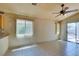 Bright dining area with tile floors, natural lighting, and backyard views through a sliding glass door at 9017 Iron Hitch Ave, Las Vegas, NV 89143