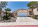 Charming one-story home with a two-car garage and low-maintenance desert landscaping at 9017 Iron Hitch Ave, Las Vegas, NV 89143