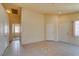 Bright living room with tile flooring and neutral walls with an open layout at 9017 Iron Hitch Ave, Las Vegas, NV 89143