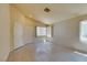 Bright living room with tile flooring, neutral walls, and natural light from windows at 9017 Iron Hitch Ave, Las Vegas, NV 89143