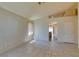 Bright living room with tile flooring and neutral walls with an open layout at 9017 Iron Hitch Ave, Las Vegas, NV 89143
