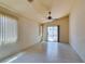 Inviting living area with tile floors and slider doors opening to a backyard, maximizing light at 9017 Iron Hitch Ave, Las Vegas, NV 89143