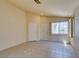 Bright living room with tile flooring, neutral walls, and natural light from windows at 9017 Iron Hitch Ave, Las Vegas, NV 89143