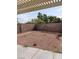 Spacious gravel backyard with covered patio at 994 River Walk Ct, Henderson, NV 89015