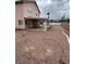 Expansive backyard with gravel, featuring a covered patio for outdoor enjoyment at 994 River Walk Ct, Henderson, NV 89015