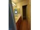 Bathroom vanity with double sinks and tile flooring, open door to shower at 994 River Walk Ct, Henderson, NV 89015