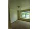 Bedroom featuring neutral carpeting and a window with a bench seat at 994 River Walk Ct, Henderson, NV 89015