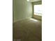 Bedroom features neutral carpet and paint and a large window for natural light at 994 River Walk Ct, Henderson, NV 89015