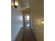 Upstairs hallway features neutral carpet, paint, and decorative lighting at 994 River Walk Ct, Henderson, NV 89015