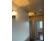 Upstairs hallway features neutral carpet, paint, and decorative lighting at 994 River Walk Ct, Henderson, NV 89015