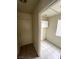 Tiled laundry room with storage and natural light at 994 River Walk Ct, Henderson, NV 89015