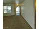 The bright living room features neutral paint, a window and access to the front door at 994 River Walk Ct, Henderson, NV 89015
