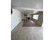 Spacious living room with tile and carpet flooring, a fireplace and neutral paint at 994 River Walk Ct, Henderson, NV 89015