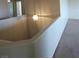 Hallway above stairs features decorative light fixtures at 994 River Walk Ct, Henderson, NV 89015