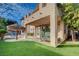 Expansive backyard features a covered patio, an artificial turf area, and a sparkling swimming pool and spa at 10829 Ickworth Ct, Las Vegas, NV 89135