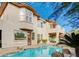 Stunning home showcasing a large pool, an upper balcony, and a covered patio area in the backyard at 10829 Ickworth Ct, Las Vegas, NV 89135
