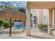 Backyard oasis featuring a pool, tiki umbrella and patio area, perfect for outdoor enjoyment at 10829 Ickworth Ct, Las Vegas, NV 89135