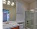 Bright bathroom featuring a vanity, tub and enclosed glass shower at 10829 Ickworth Ct, Las Vegas, NV 89135