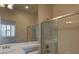 Well-lit bathroom with glass shower, single sink vanity, and modern fixtures at 10829 Ickworth Ct, Las Vegas, NV 89135