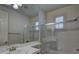 Bathroom with tile shower and glass door at 10829 Ickworth Ct, Las Vegas, NV 89135