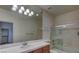 Bathroom with large mirror, vanity, and shower with glass enclosure at 10829 Ickworth Ct, Las Vegas, NV 89135