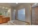 Bright bathroom boasts a soaking tub, walk-in shower and dual vanities with lots of storage at 10829 Ickworth Ct, Las Vegas, NV 89135