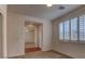 Bedroom with plantation shutters and hardwood flooring visible through the open doorway at 10829 Ickworth Ct, Las Vegas, NV 89135