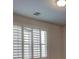 Sun-drenched bedroom with large windows and plantation shutters at 10829 Ickworth Ct, Las Vegas, NV 89135