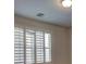 Bedroom featuring window with plantation shutters at 10829 Ickworth Ct, Las Vegas, NV 89135