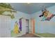 Whimsical bedroom with colorful mural art, custom painting and themed decor at 10829 Ickworth Ct, Las Vegas, NV 89135