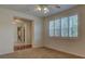 Bedroom featuring plantation shutters and an open doorway to a living space at 10829 Ickworth Ct, Las Vegas, NV 89135